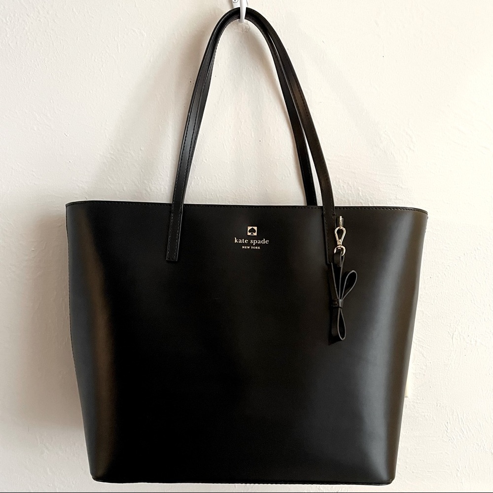 Kate Spade black leather tote bag with hot pink lining. Very gently used.